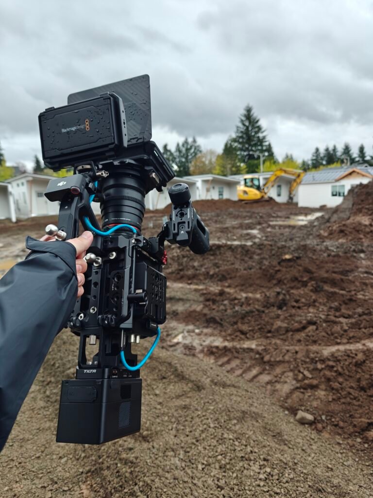 Camera monitor displaying a recorded interview with a woman wearing a Wolf Industries sweatshirt